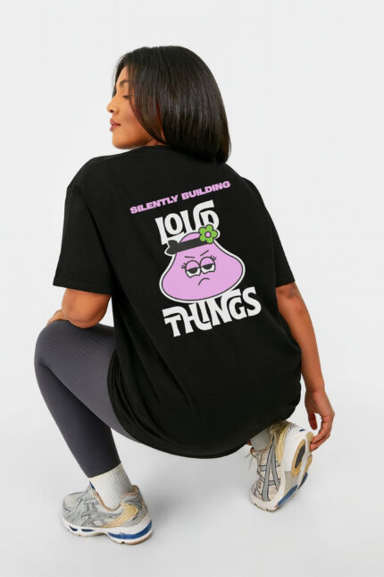 RahRaha Hustle Black T-Shirt for Women – Rear angled view, pink graphic and slogan artwork