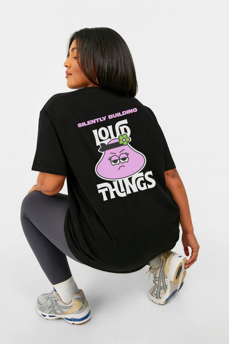 RahRaha Hustle Black T-Shirt for Women – Rear angled view, pink graphic and slogan artwork