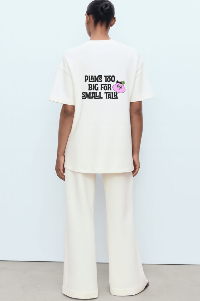 RahRaha Hustle White T-Shirt for Women – Back print with pink “Plans Too Big For Small Talk” character graphic