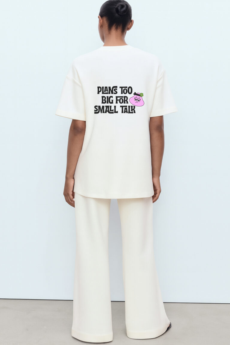RahRaha Hustle White T-Shirt for Women – Back print with pink “Plans Too Big For Small Talk” character graphic