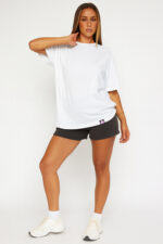 Model Wearing RahRaha Hustle White Oversized T-Shirt – Confident Pose